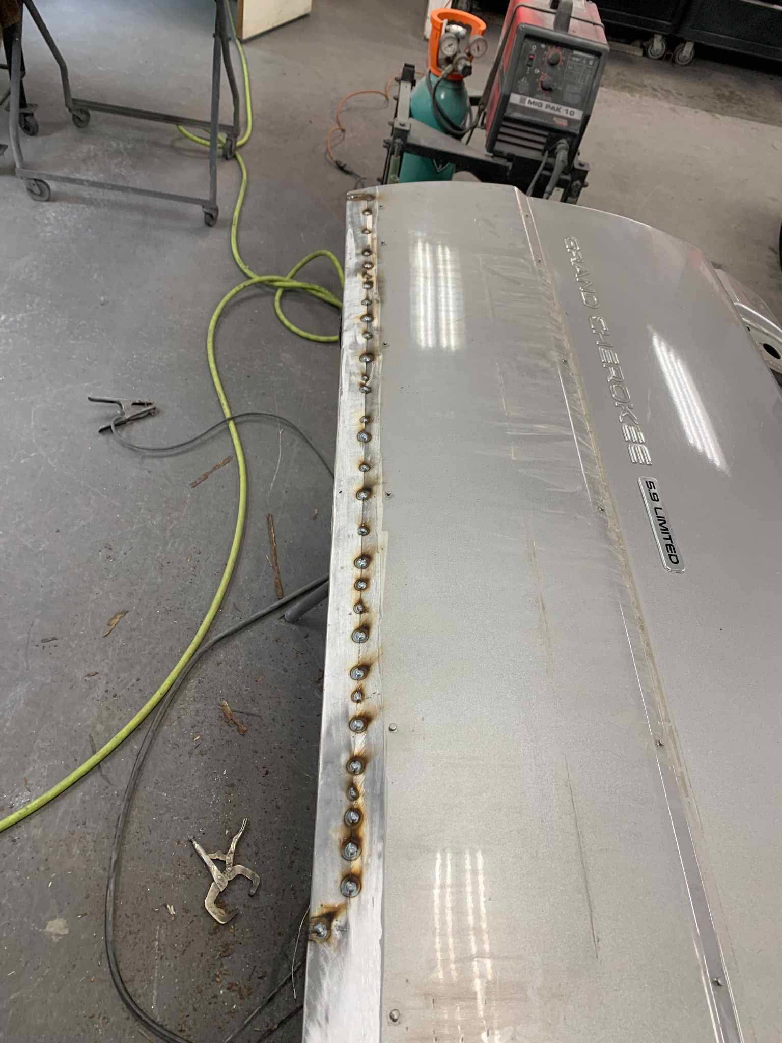 New metal being welded into the liftgate bottom