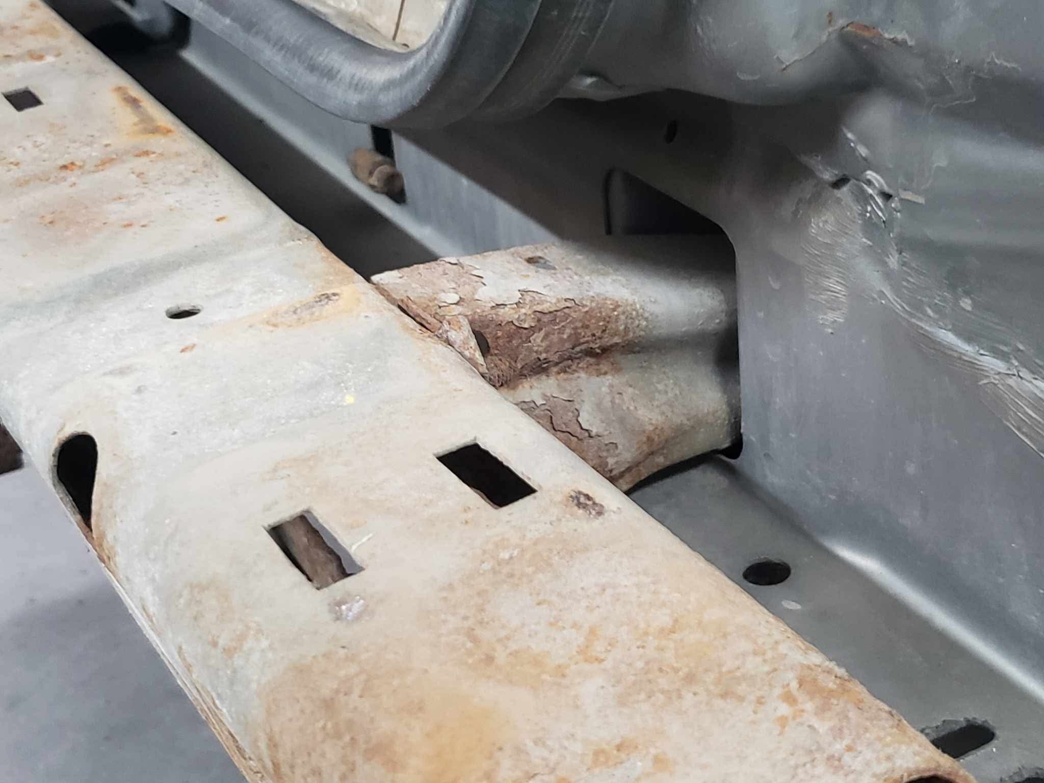 Rear bumper pulled — totally eaten through