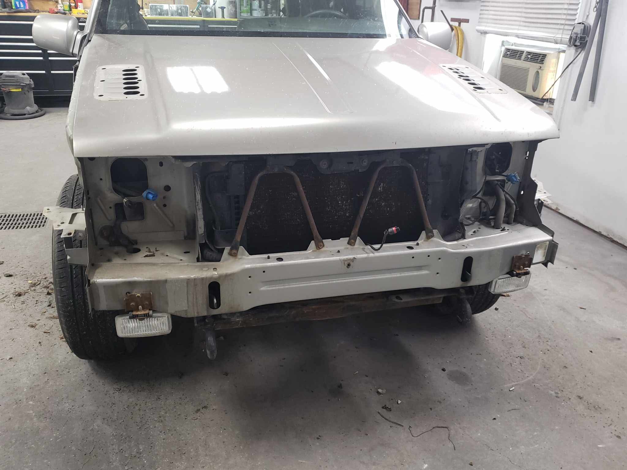 Front end stripped — no fenders, no grille